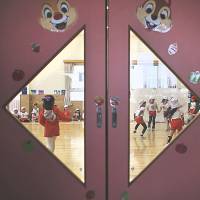 Children play dodge ball at the Emporium kindergarten in Koriyama, Fukushima Prefecture, in February 2014. | REUTERS
