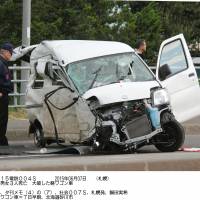 A mini-wagon is left destroyed Sunday after a fatal crash accident involving another passenger car in Sunagawa, central Hokkaido. | KYODO