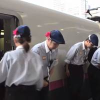 A video titled \"7-Minute Miracle\" produced by American journalist Charli James shows workers lining up and bowing after cleaning the interior of a bullet train in Tokyo Station. | YOUTUBE