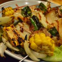 Messy feast: One of the signature dishes at Isaribi is skewers loaded with corn, bacon and chicken. | J.J. O\'DONOGHUE