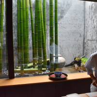 Watching time go by: A young apprentice at Rakushin prepares a dish in front of the seasonal window display. | J.J. O\'DONOGHUE