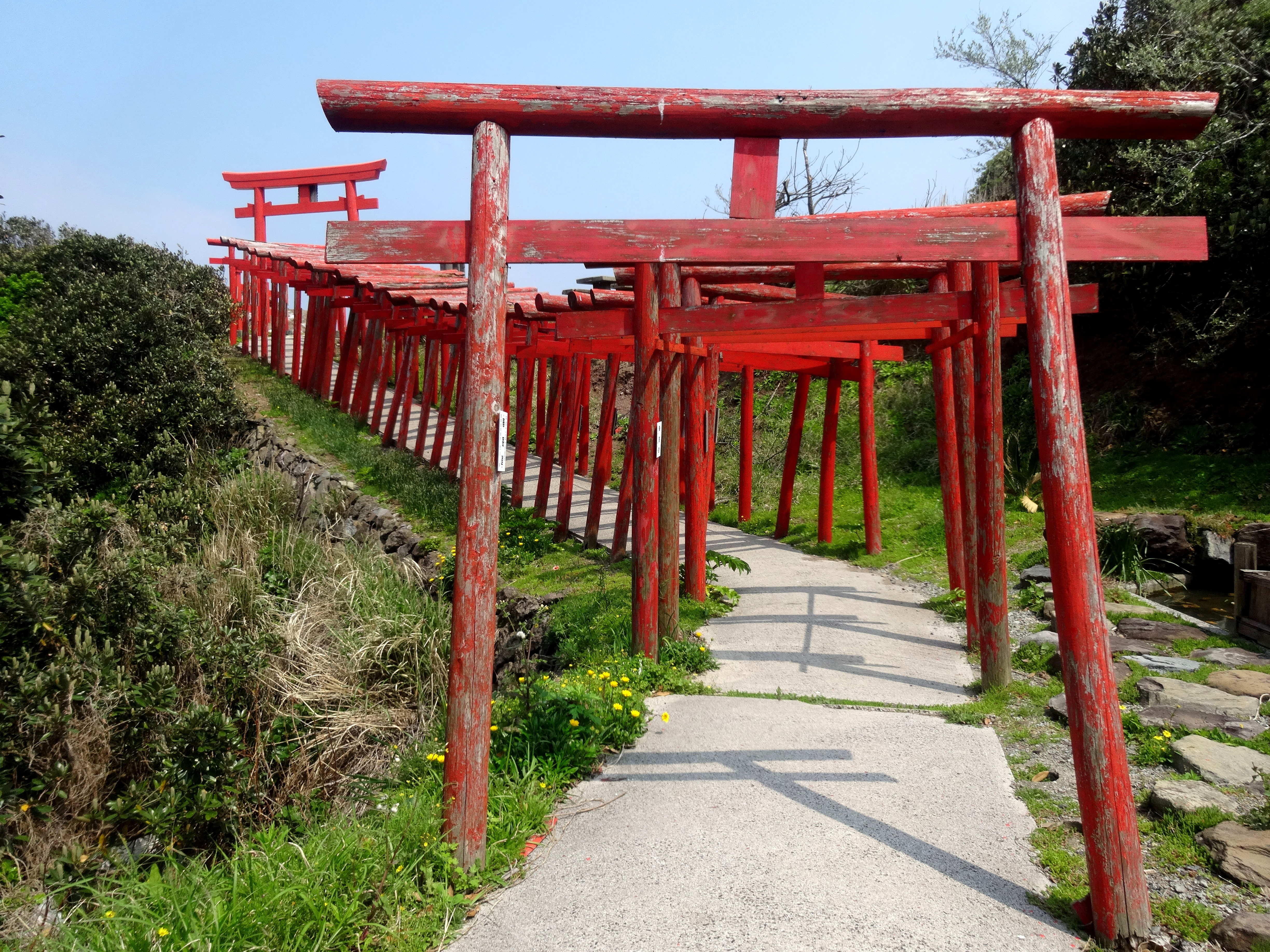 One hundred and twenty-three torii gates lead to Motonosumi Shrine in the Nagato region on Yamaguchi Prefecture’s rocky northern coast. | MANDY BARTOK