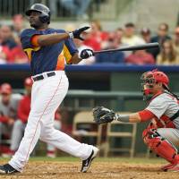 St. Louis Cardinals catcher Rob Johnson looks on as Houston Astros\' Chris Carter hits a two-run homer off pitcher Jason Motte during the fifth inning of a MLB spring training game in Kissimmee, Florida, in March 2013. The FBI and federal prosecutors are investigating the St. Louis Cardinals for hacking rival  Houston Astros to steal closely guarded information about player personnel. | REUTERS