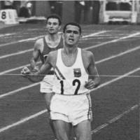 Ron Clarke, seen here winning the qualifying heat in the men\'s 5,000 meters as the 1964 Tokyo Olympics, lit the Olympic flame at the 1956 Melbourne Games. He later served as mayor of Gold Coast, Australia. | PHOTO COURTESY OF TRACK &amp; FIELD NEWS (USA)