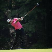 Hideki Matsuyama hits a shot on the 15th hole at the Memorial tournament in Dublin, Ohio, on Friday. | AP
