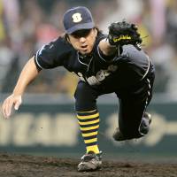Kyuji Fujikawa, seen playing for the Hanshin Tigers in 2011, is set to join the Kochi Fighting Dogs in the Shikoku Island League Plus. | KYODO