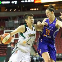 Seattle\'s Ramu Tokashiki drives on Phoenix\'s Rebecca Tobin in preseason action. | NEIL ENNS/SEATTLE STORM