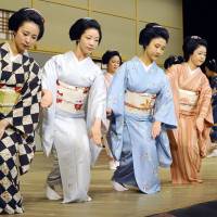 <em>Maiko</em> (apprentice geisha) practice in Kyoto on Tuesday ahead of a special performance in the city. Twenty maiko will take part in the Miyako no Nigiwai dance on June 27 and 28. | KYODO