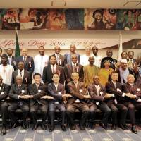 Dean of the African Development Corporation and Eritrea Ambassador Estifanos Afeworki (front row, seventh from right); State Minister for Foreign Affairs Minoru Kiuchi (seventh from left); Secretary-General, Japan-African Union parliamentary Friendship League Asahiko Mihara (sixth from left); President of the National Assembly of Djibouti Mohamed Ali Houmed, (sixth from right); Director-General, Affrican Affairs Depaartment, Ministry of Foreign Affairs Norio Maruyama, (fifth from right); and Lesotho Ambassador and Chair of the Africa Day Reception 2015 Richard Ramoeletsi (fourth from right) pose with other ambassadors, and Diet members during a reception to celebrate Africa Day at the Angolan Embassy in Tokyo on May 26. | YOSHIAKI MIURA
