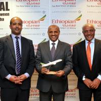 Ethiopian Airlines CEO Tewolde Gebremariam (center) poses with Area Manager of Japan Mesay Shiferaw (left) and Ethiopian Tourism Organization CEO Solomon Tadesse during a press conference announcing direct flights between Narita and Addis Ababa at the Tokyo Marriott Hotel on April 23. | YOSHIAKI MIURA