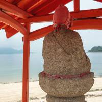 A Jizo statue on a stretch of natural beach just south of Setoda. | STEPHEN MANSFIELD