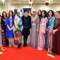 The 17th Arab Charity bazaar, organized by the Society of Wives of Arab Ambassadors and Heads of Missions in Japan (SWAAJ), was held at the Izumi Garden Gallery in Tokyo on April 12. Prime Minister Shinzo Abe’s wife Akie (sixth from left), SWAAJ President Jamila Al-Suwaidi (sixth from right) of Qatar and Vice President Samira Ali Abdelaziz (fifth from left) of Sudan, and other SWAAJ members pose after the ribbon-cutting. | YOSHIAKI MIURA