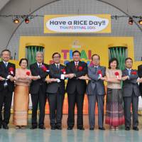 hai Deputy Prime Minister and Foreign Minister (ninth from left) Tanasak Patimapragon, poses with (to his left) Thai Ambassador to Japan Sihasak Phuangketkeow and (to his right) former Prime Minister Yasuo Fukuda and others during the opening ceremony of the Thai Festival 2015, “Have a RICE Day!!” at Yoyogi Park in Tokyo on May 16. | YOSHIAKI MIURA