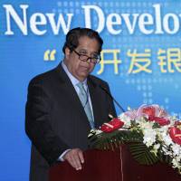 Kundapur Vaman Kamath, president of the New Development Bank, gives a speech during an opening ceremony of the bank in Shanghai on Tuesday. | REUTERS