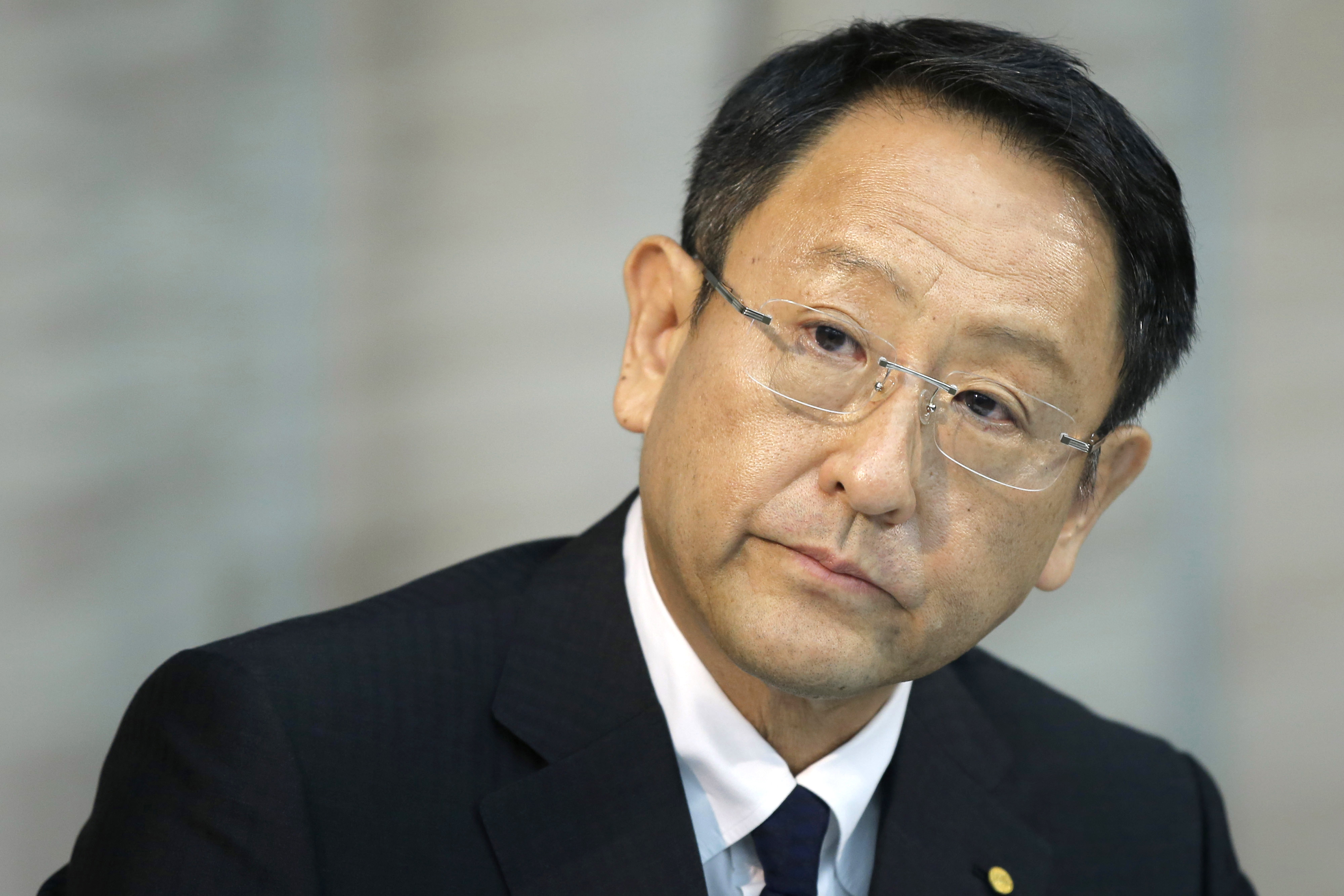 Akio Toyoda, president of Toyota Motor Corp., listens at a news conference in Tokyo on June 19 at which he expressed support for communications director Julie Hamp following her arrest. | BLOOMBERG