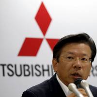 Mitsubishi Motors Corp. President Tetsuro Aikawa speaks during a news conference at the company\'s headquarters in Tokyo on Monday. The automaker said it will stop making vehicles in the U.S. this year and will close down its plant in Illinois if no buyer is found. | REUTERS