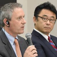 Franklin Pray (left), CEO of Intrepid Aviation, answers questions next to Masaru Morimoto (right), managing director of Delta Air Lines Japan, during a news conference in Tokyo on Wednesday. | AFP-JIJI