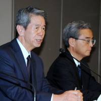 Toshiba Corp. President Hisao Tanaka (left) faces the media during a news conference about the firm\'s accounting scandal in Tokyo on Tuesday. | SATOKO KAWASAKI