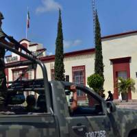 Troops patrol the Badiraguato community in Sinaloa State, Mexico, the homtown of escaped drug lord Joaquin Guzman. | AFP-JIJI