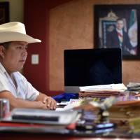 Mario Valenzuela, mayor of the Badiraguato community in Sinaloa State, Mexico, speaks during an interview with AFP on Friday. One week after drug boss Joaquin Guzman escaped prison again, his legend has grown in his home region in northwestern Sinaloa state, where he is revered as a benevolent bandit despite his drug cartel\'s murderous record. | AFP-JIJI