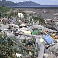 In this undated photo provided by the Alaska Department of Environmental Conservation, debris litters the shore on Montague Island, Alaska. A massive cleanup effort is getting underway in Alaska, with tons of marine debris, some likely sent to sea by the 2011 tsunami in Japan, set to be airlifted from rocky beaches and taken by barge for recycling and disposal in the Pacific Northwest. Massive project afoot to remove debris along Alaska shores, including from '11 tsunami