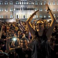 \"No\" supporters shout slogans during celebrations following a referendum in front of the parliament in Athens on Sunday. Greeks overwhelmingly rejected conditions of a rescue package from creditors on Sunday, throwing the future of the country\'s eurozone membership into further doubt and deepening a standoff with lenders. | REUTERS