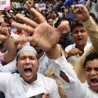 Activists of the Indian Youth Congress (IYC) shout anti-goverment slogans during a protest Monday in New Delhi following a suspected militant attack in Punjab\'s Gurdaspur district. | AFP-JIJI