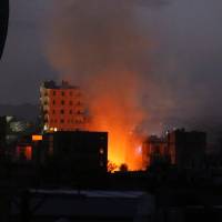 Fire and smoke rise from the site of a car bomb attack in Sanaa Monday. The Yemen branch of Islamic State claimed it carried out the deadly blast. | AP