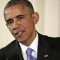 President Barack Obama speaks during a news conference in the East Room of the White House Wednesday. The president rejected the idea of revoking Bill Cosby\'s Presidential Medal of Freedom because of sexual misconduct allegations. Obama said there\'s no precedent or mechanism to take back the medal. He declined to talk about the specific allegations against Cosby because there are pending legal matters. | AP