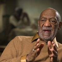 Entertainer Bill Cosby gestures during an interview last November at the Smithsonian\'s National Museum of African Art in Washington. President Barack Obama rejected the idea Wednesday of revoking Cosby\'s Presidential Medal of Freedom because of sexual misconduct allegations. | AP