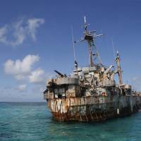 The Sierra Madre transport ship of the Philippines navy lies grounded on the disputed Second Thomas Shoal, in the Spratly Islands. Several marines live on the vessel, turning it into a military outpost asserting Manila\'s claim to those waters in the South China Sea. | REUTERS