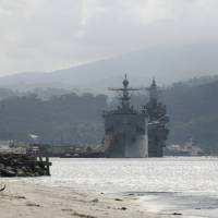 U.S. warships are seen docked at Subic bay in Olongapo city, north of Manila, in this October 14, 2014, file photo. The Philippines will station new fighter jets and two frigates at the former U.S. naval facility in Subic Bay from early next year, officials said, the first time the massive installation has functioned as a military base in 23 years. Using Subic Bay would allow the Philippine air force and navy to respond more effectively to Chinese moves in the disputed South China Sea, security experts said. | REUTERS