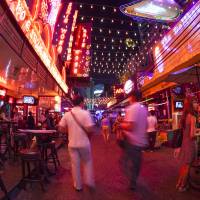 Bangkok\'s Soi Cowboy entertainment district &#8212; one of the red-light areas in the city &#8212; in seen through a fisheye lens in June 2012. | ISTOCK