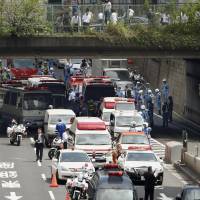 Several vehicles, including a police van, collided Friday morning on a loop line of the Metropolitan Expressway. | KYODO