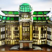 A stained-glass model of the then Hiroshima Prefectural Industrial Promotion Hall, made by volunteer guide Okihiro Terao, is seen on July 15. | KYODO