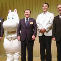 Operators of a Moomin-themed amusement park, to open in Saitama Prefecture in 2017, pose for a photo on Tuesday. | KYODO