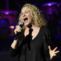 In this May 14 file photo, singer Carole King performs in Los Angeles. | CHRIS PIZZELLO / INVISION / AP