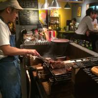 Street food: Argentinian sausage on the grill at Mi Choripan. | ROBBIE SWINNERTON