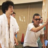 As fate would have it: Hiroyuki “Sabu” Tanaka directs actor Kenichi Matsuyama in “Chasuke’s Journey.” Sabu tempts fate in new film
