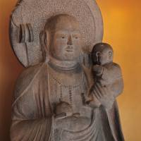 City smile: The kosodate ojizōsama in Tokyo’s Bunkyo Ward greets visitors to the area’s Jizo-dori. | KIT NAGAMURA
