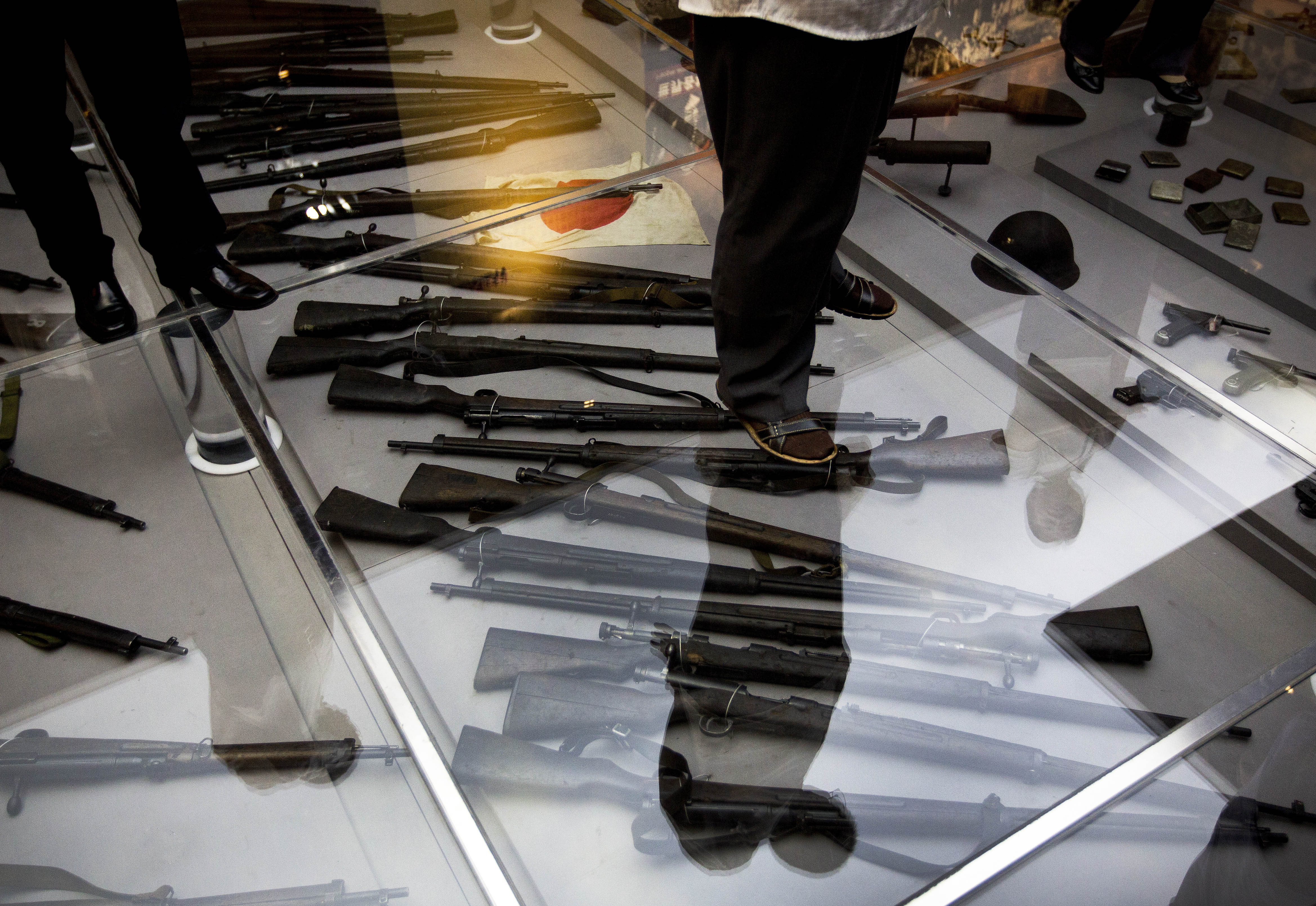 Not forgotten: Visitors to the Museum of the War of the Chinese People's Resistance Against Japanese Aggression look at weapons used by Japanese forces during World War II. | AP