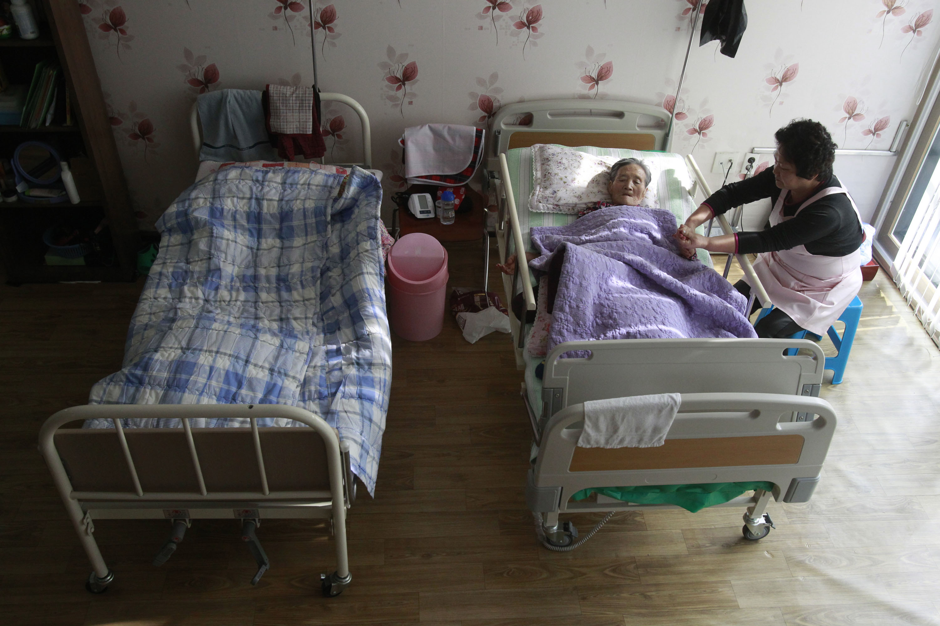 Safe place: Kim Jong-boon receives care at the House of Sharing, a nursing home for former 'comfort women' in Toechon, South Korea, last year. | AP
