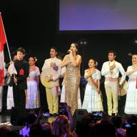 Peruvian singer Fabiola de la Cuba (center) performs at \"PERU FESTIVAL 2015 KYODAI,\" an event celebrating the 194th Anniversary of Peruvian Independence Day at Shin Kiba Studio Coast in Tokyo on July 26. | YOSHIAKI MIURA