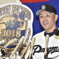 Chunichi Dragons player-manager Motonobu Tanishige on Tuesday speaks to the media after appearing in his 3,018th game at Nagoya Dame. Tanishige  set the record for most games played in Nippon Professional Baseball. | KYODO