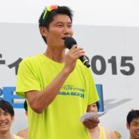 Former Olympic beach volleyball player Kentaro Asahi speaks to fans after the V-League Summer Festival. | KAZ NAGATSUKA