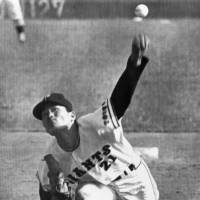 Kazumi Takahashi, seen pitching for the Yomiuri Giants in 1970, earned two Sawamura Awards during his pro career. Takahashi died at age 69 on Tuesday. | KYODO