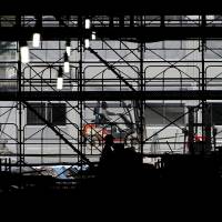 A worker drives a forklift at a construction site in Tokyo on Wednesday. Core machinery orders fell 7.9 percent in June, data released Thursday showed. Core machinery orders down 7.9% in June