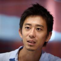 Kazuya Takeda, chief executive officer of restaurant review app Retty, speaks during an interview in Tokyo on July 28. | BLOOMBERG