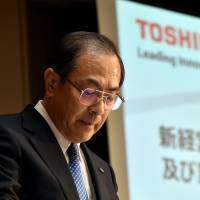 Toshiba President Masashi Muromachi announces a new management lineup Tuesday at the company\'s headquarters in Tokyo. | AFP-JIJI