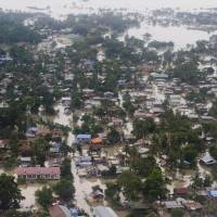 An aerial view shows floodwaters inundating houses and vegetation in Kalay, upper Myanmar\'s Sagaing region, Relentless monsoon rains have triggered flash floods and landslides, destroying thousands of houses, farmland, bridges and roads. | AFP-JIJI